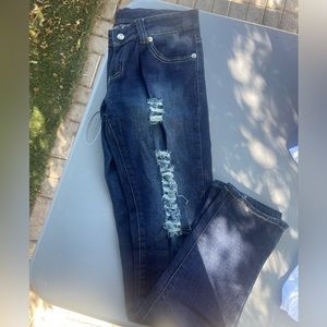 LEVI’S ripped dark blue jeans. Light used.